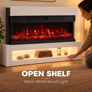 Woman adjusting the white 3-sided electric fireplace with the glowing flames in the foreground