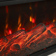 Close-up of orange and red flames glowing over faux logs
