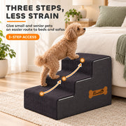 Small dog climbing the three steps beside a bed with arrows marking the route