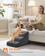 Lifestyle photo of a dog climbing the 3-step stairs beside a sofa