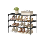 Songmics 3-tier black fabric shoe rack styled with shoes and decor