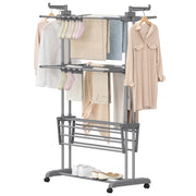 Grey 3-tier clothes airer loaded with shirts and towels on a white background