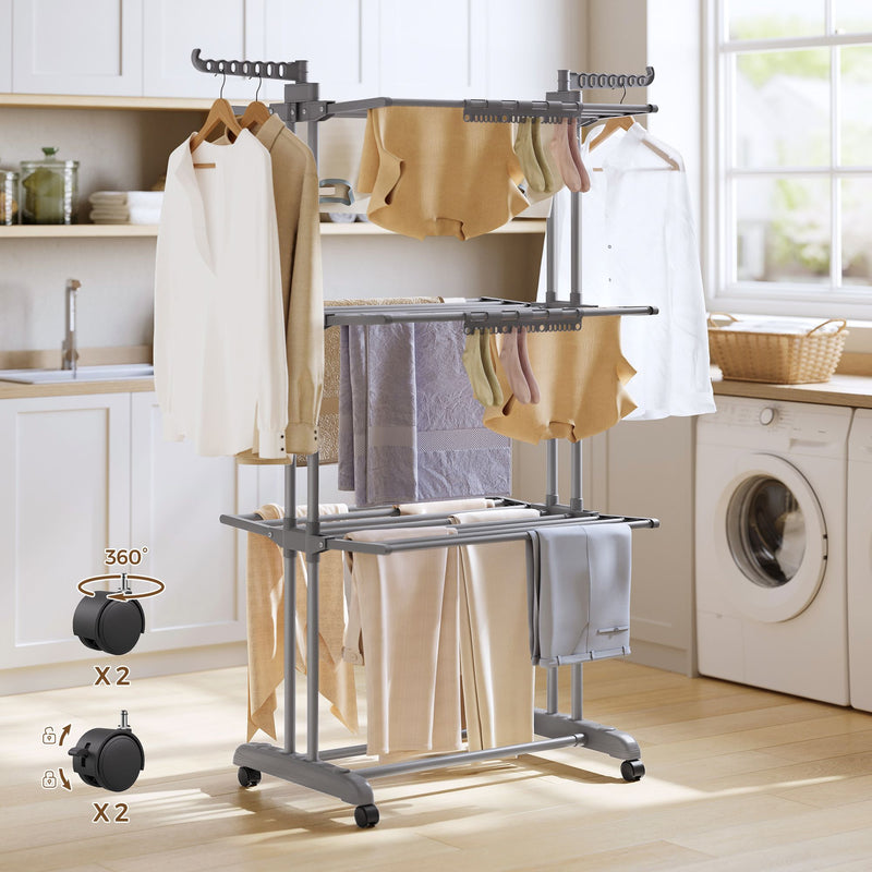 Grey clothes airer in a kitchen with callouts showing 4 castors, 2 with brakes