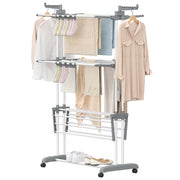 White 3-tier clothes airer loaded with shirts and towels on a white background