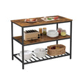 Vasagle 3 tier kitchen island in rustic brown with food and boards on the worktop