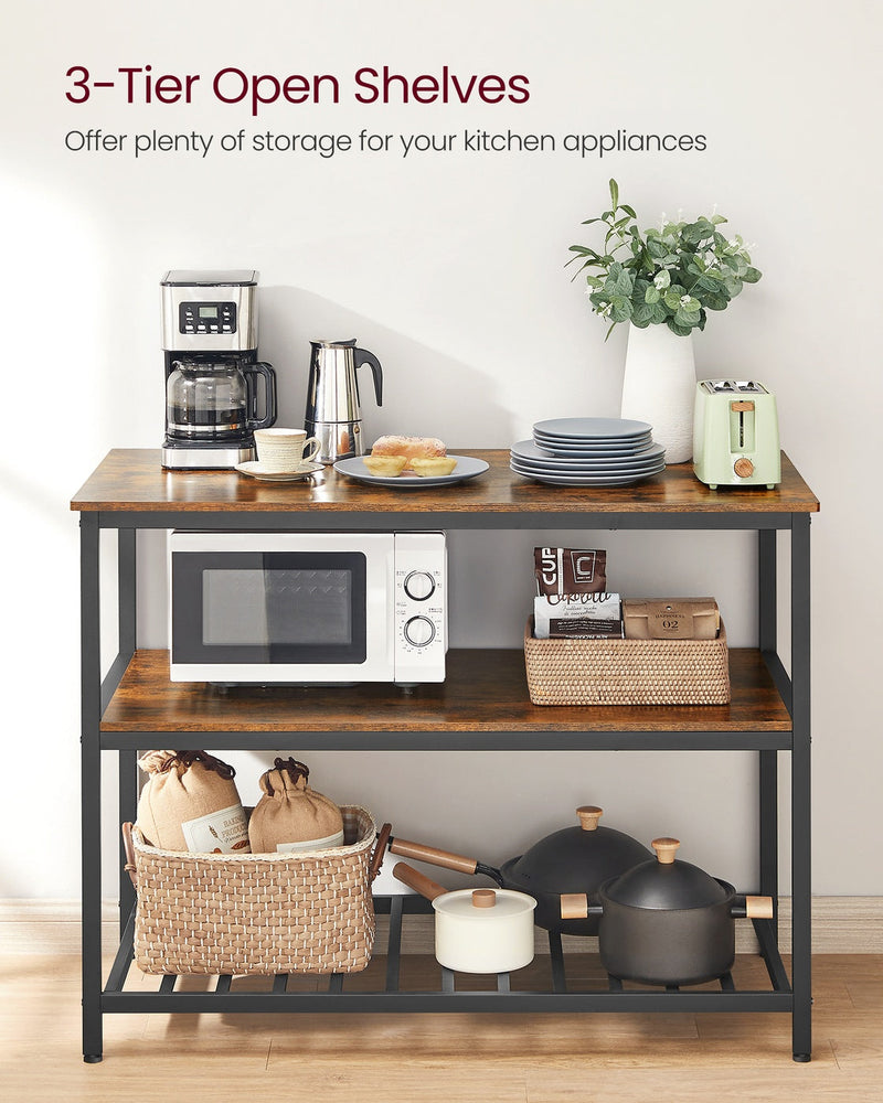 Three open shelves holding a microwave, baskets and pans in a bright kitchen
