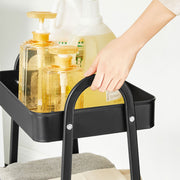 Close-up of the metal handle and wire basket on the rolling cart