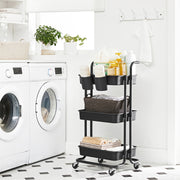Storage cart styled in a laundry room holding detergent and folded towels