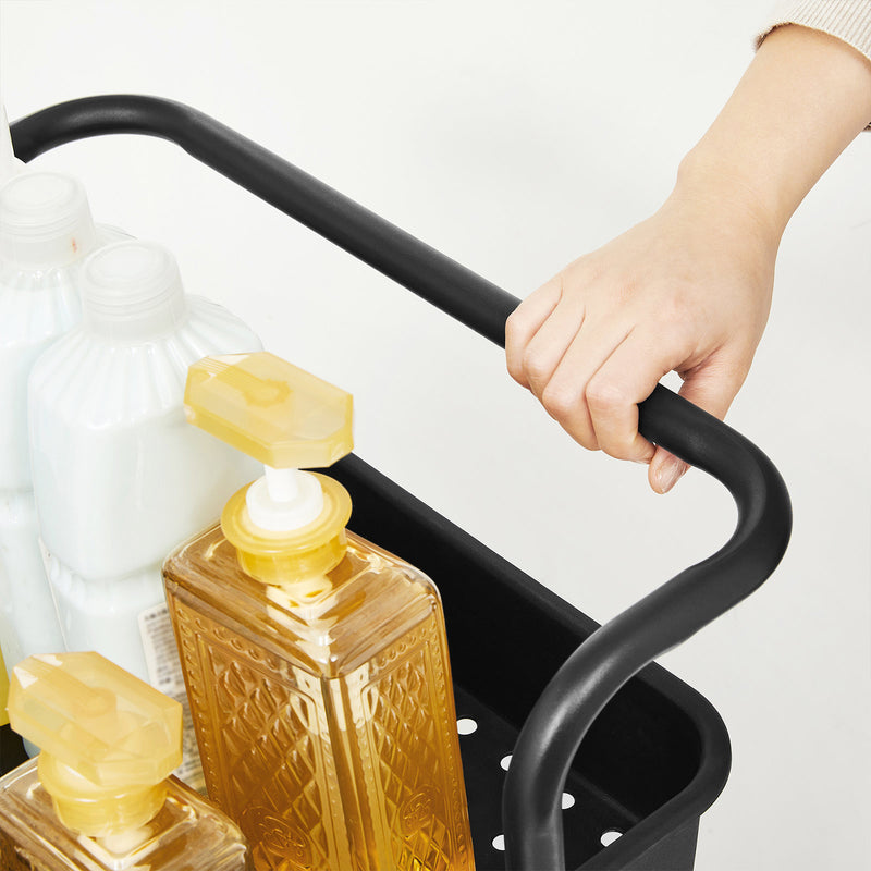 Close-up of a hand pushing the cart by its carry handle