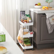 White trolley in a kitchen holding jars, packets and a net bag hung from a side hook