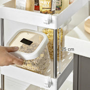 Close-up showing the 25 cm of clearance between two trays of the white trolley