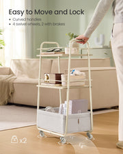 Person steering the trolley by its curved handle on four swivel wheels