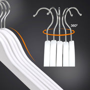 Close-up of the 360 degree swivel metal hooks on five white wooden hangers
