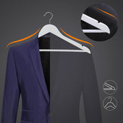White wooden hanger holding a navy suit jacket, with the shoulder notch shown close up