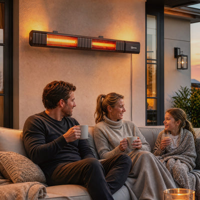 Family relaxing on a sofa under the wall-mounted patio heater at dusk