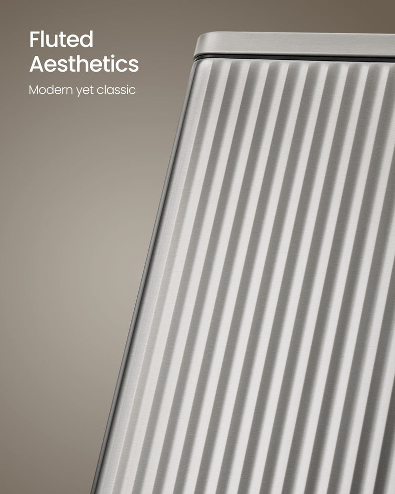 Close-up of the fluted, ridged steel side panel on the silver pedal bin
