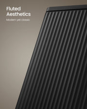 Close-up of the fluted, ridged steel side panel on the black pedal bin