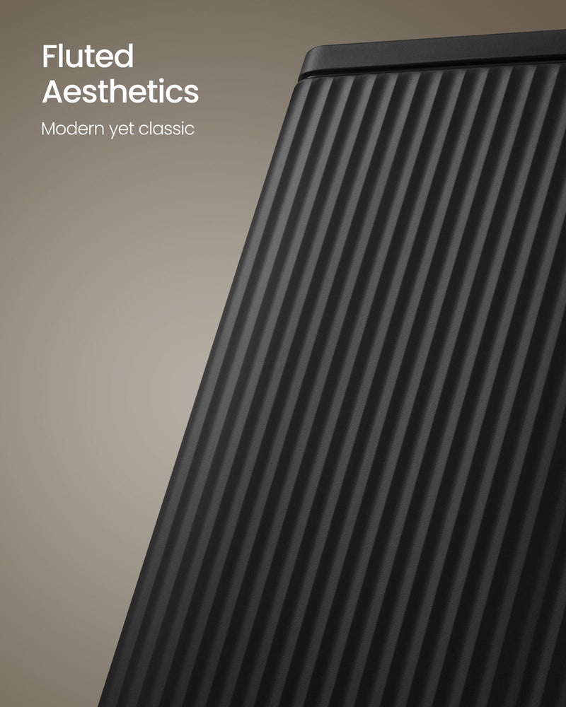 Close-up of the fluted, ridged steel side panel on the black pedal bin