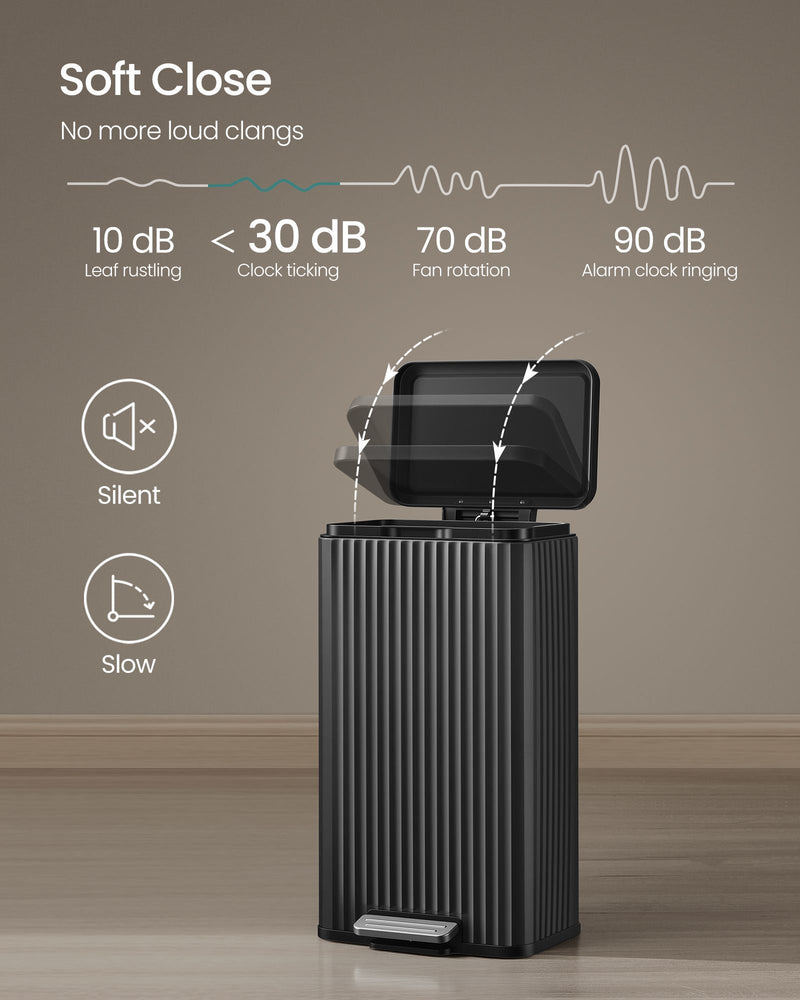 Black pedal bin shown opening slowly on its soft-close lid mechanism