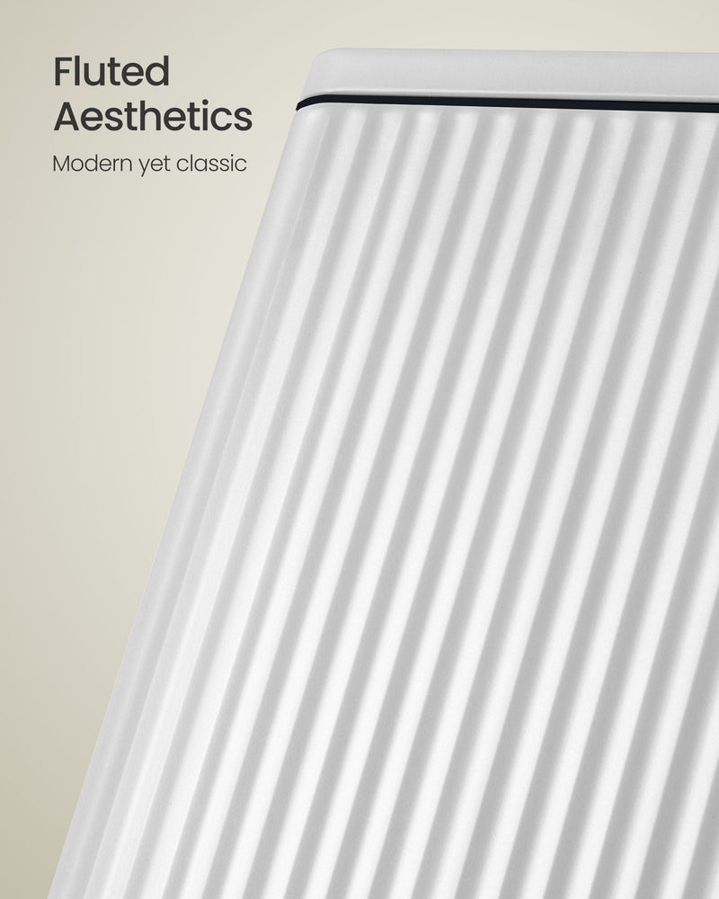 Close-up of the fluted, ridged steel side panel on the white pedal bin