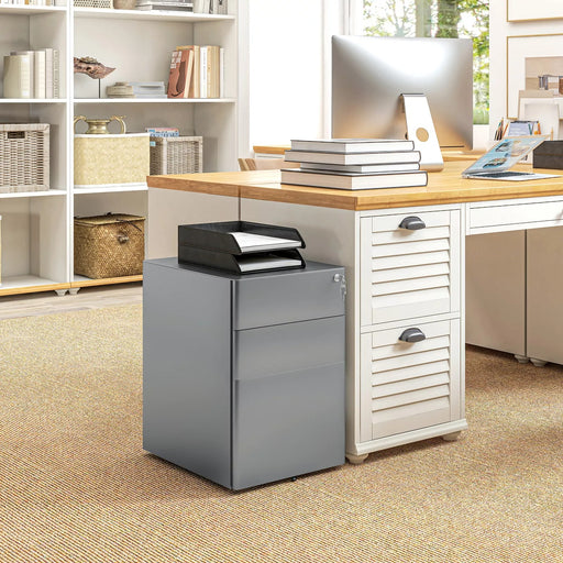 Image of a Grey 3 Drawer Under Desk Pedestal With Wheels and a Lock.