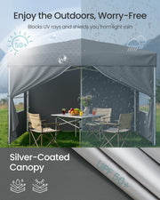 Silver-coated canopy blocking UV rays on one side and shedding light rain on the other