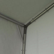 Interior corner showing the steel roof bars and the taut pale inner lining