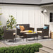 Image of a 4 Piece Brown Rattan Patio Furniture Set With Taupe Cushions