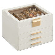 Cloud white 4-layer jewellery box with gold clasp and 3 drawers, closed with jewellery visible under the glass lid