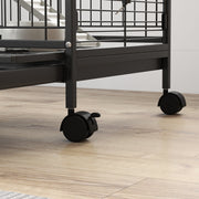 Close-up of the cage wheels and lower frame on a wooden floor