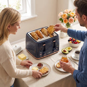 Couple sharing breakfast toast at a table with the honeycomb toaster