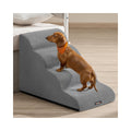 Dachshund climbing Feandrea 4-step dog stairs in Dove Grey beside a bed