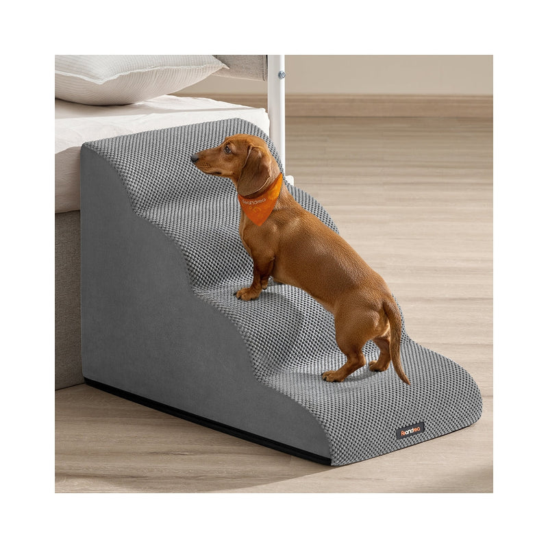 Dachshund climbing Feandrea 4-step dog stairs in Dove Grey beside a bed