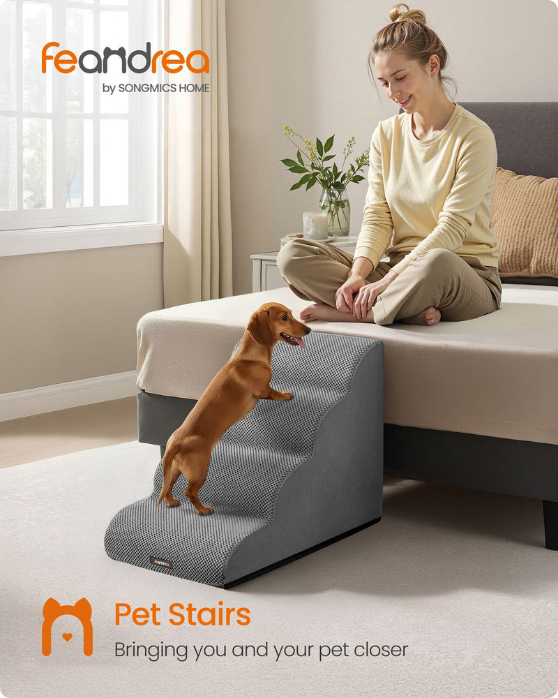 Feandrea Pet Stairs banner showing a dachshund climbing the 4-step dog stairs in Dove Grey beside a bed