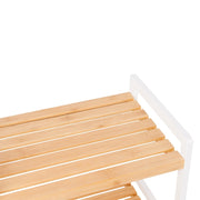 Close-up of the slatted bamboo shelf boards meeting the white frame
