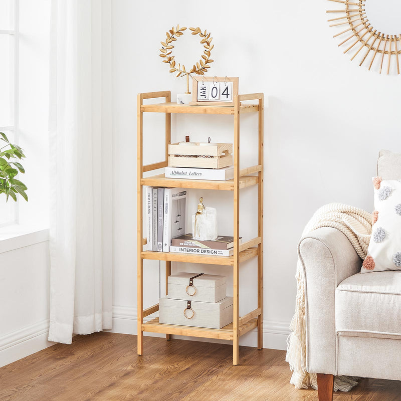 Bamboo shelves in a living room stacked with books, fabric boxes and ornaments