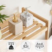 Close-up of a slatted bamboo shelf with soap dispensers and a 15 kg load icon