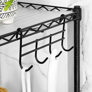 Close-up of the removable side hooks holding a flannel and a brush