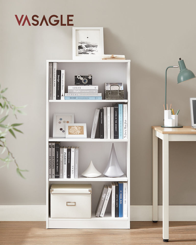 White 4-tier bookcase styled with books and a camera beside a study desk