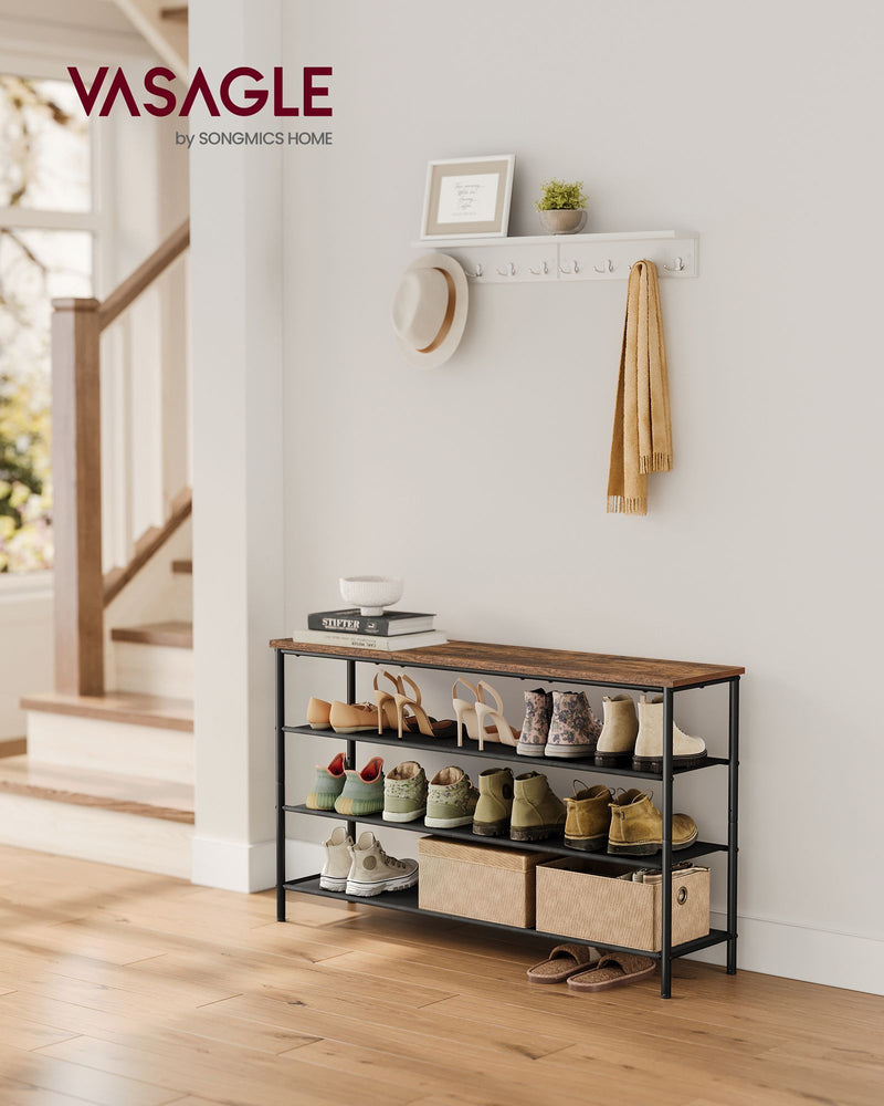 Shoe rack styled in an entryway holding shoes and bags
