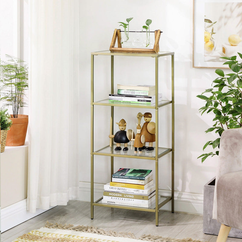 Close view of the gold glass shelving unit holding books, ornaments and plants