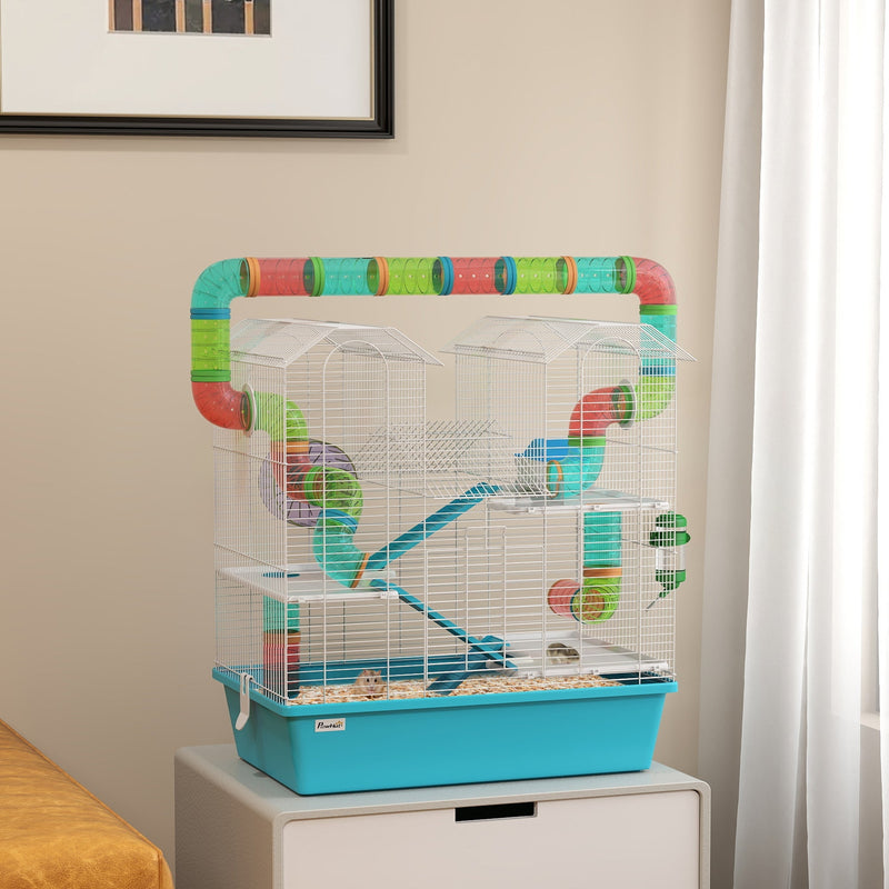Hamster cage with tubes shown on a storage unit in a bedroom with a hamster inside