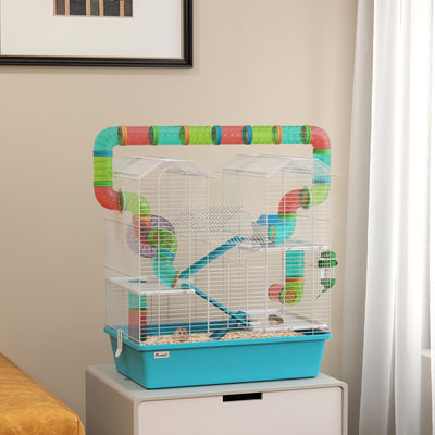 Hamster cage with tubes shown on a storage unit in a bedroom with a hamster inside