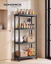 Black shelving unit in a kitchen holding jars, utensils and baskets