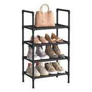 Black 4 tier shoe rack with a handbag on top and shoes on three shelves