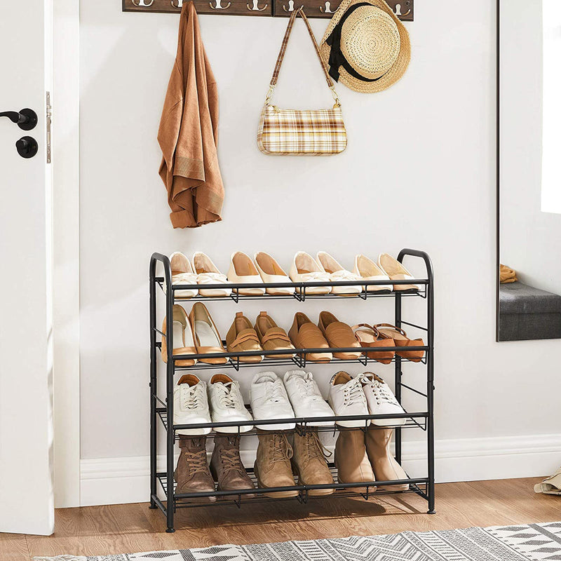 Black shoe rack in a hallway under coat hooks holding four rows of shoes