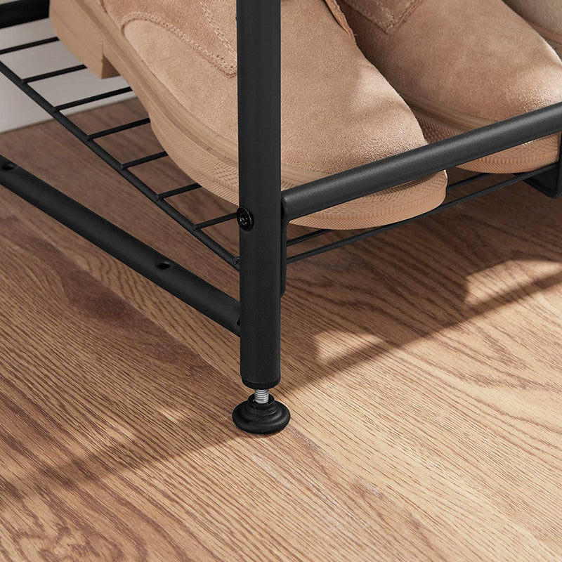 Close-up of a screw-in adjustable foot levelling the rack on a wooden floor