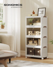 The white 4-tier Songmics storage tower styled beside an armchair in a bright living room