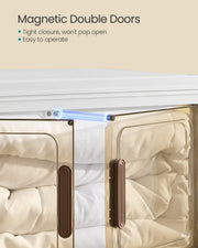 Close-up of the magnetic double doors on the white storage box with bedding inside