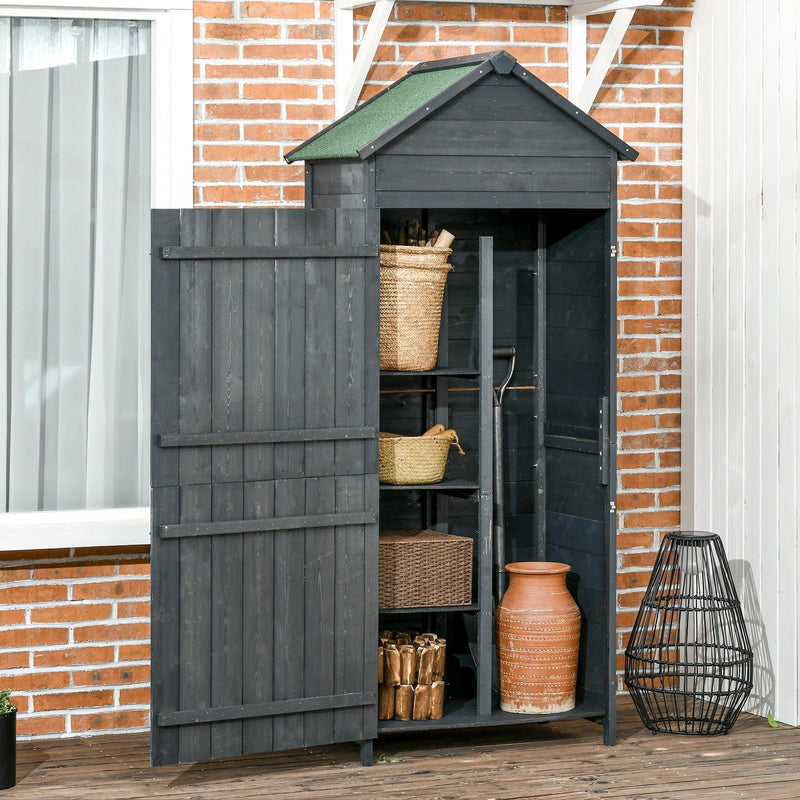 Slim wooden shed open against a brick wall showing shelved baskets, logs and a terracotta pot